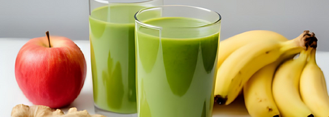Green smoothie surrounded by fruit