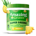 Amazing Grass Super Greens supplement container with pineapple flavor on a white background