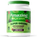 Container of Amazing Grass Super Greens Sweet Berry supplement on a white background