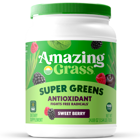 Container of Amazing Grass Super Greens Sweet Berry supplement on a white background