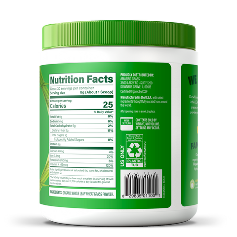 Container of organic wheat grass powder with nutrition facts label on a white background